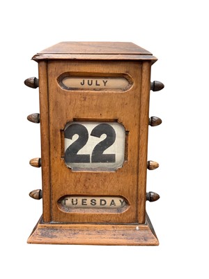 Lot 330 - Early 20th century wooden perpetual desk calendar, 21.5cm high