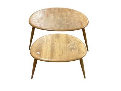 Lot 1363 - Nest of two Ercol pebble tables