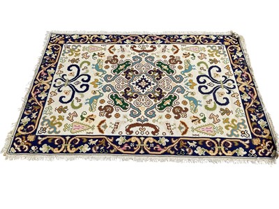 Lot 1372 - Three various rugs, 175cm x 121cm, 171cm x 120cm and 125cm diameter
