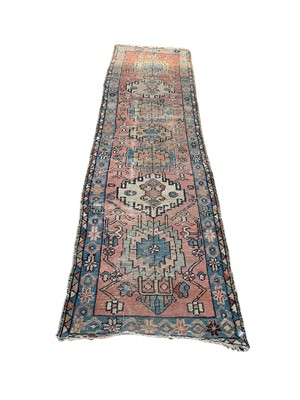 Lot 1373 - Eastern runner with seven central medallions on blue, red and cream ground, 273cm x 72cm, together with another Eastern rug, 175cm x 157cm (2)