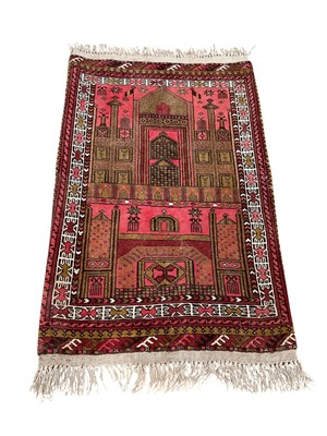 Lot 1377 - Two Eastern rugs, 118cm x 77cm and 186cm x 89cm, together with a prayer mat, 62cm x 44cm (3)