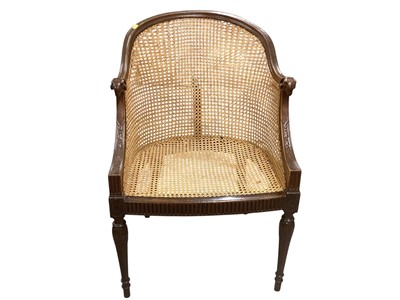 Lot 1418 - Edwardian mahogany framed bergère tub chair with ram's head terminals