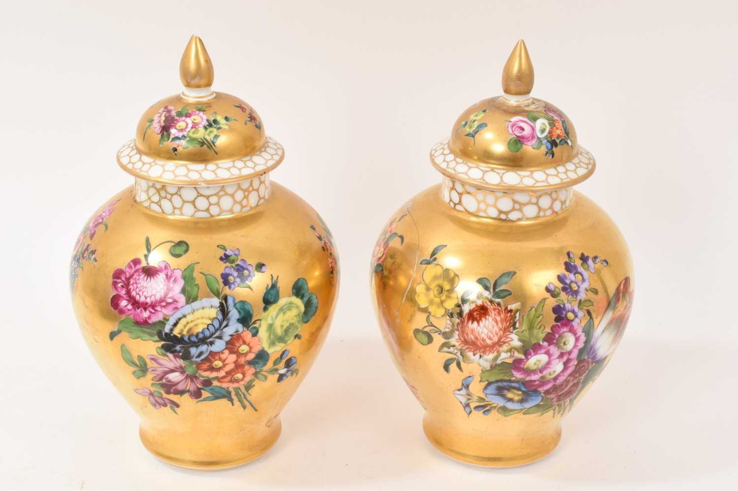 Lot 7 - Pair of Meissen-style porcelain vases and covers, circa 1900, painted with flowers on a gold ground, crossed swords marks, 23.5cm high