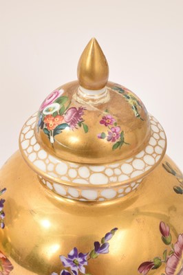 Lot 7 - Pair of Meissen-style porcelain vases and covers, circa 1900, painted with flowers on a gold ground, crossed swords marks, 23.5cm high