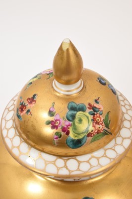 Lot 7 - Pair of Meissen-style porcelain vases and covers, circa 1900, painted with flowers on a gold ground, crossed swords marks, 23.5cm high