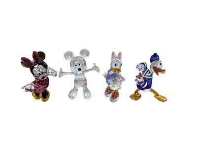 Lot 691 - Collection of ten Swarovski Crystal Disney figures including Donald Duck, Minnie Mouse, Winnie the Pooh, Bugs Bunny etc (all boxed)