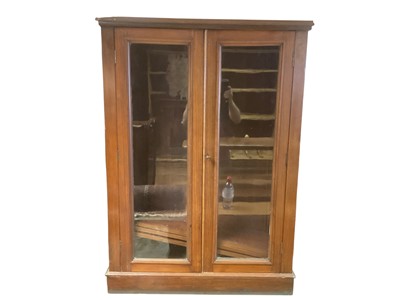 Lot 1381 - Edwardian walnut bookcase with adjustable shelves enclosed by glazed doors, 85cm wide, 31cm deep, 117.5cm high