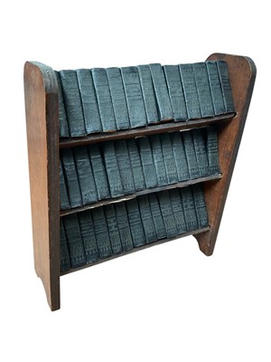 Lot 1643 - A miniature set of the complete works on Shakespeare, leather bound, on a wooden bookcase, published by Allied Newspapers