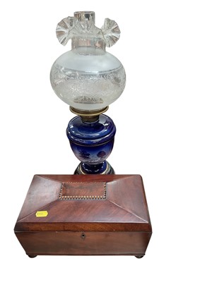 Lot 523 - 19th century mahogany tea caddy (lacking interior), together with a ceramic oil lamp, (2).