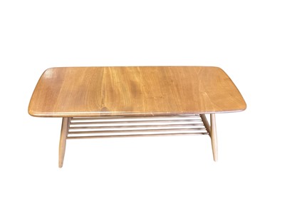 Lot 1400 - Ercol coffee table with magazine rack undertier, 104cm x 46cm x 36cm high