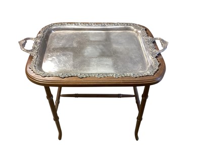 Lot 1405 - Large antique silver plated two handled tray on a later purpose made wooden stand, 76cm wide, 51cm deep, 54cm high
