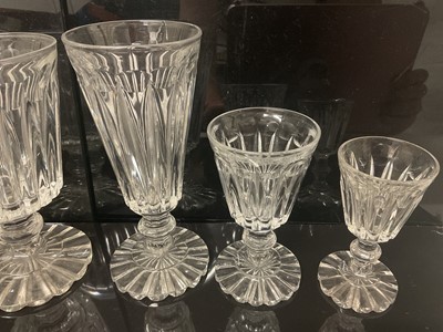 Lot 87 - Victorian glass table service, each drinking glass with tapered fluted bowl on fluted pedestal bases