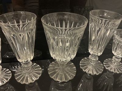 Lot 87 - Victorian glass table service, each drinking glass with tapered fluted bowl on fluted pedestal bases