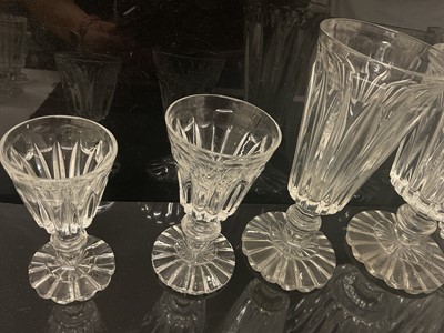Lot 87 - Victorian glass table service, each drinking glass with tapered fluted bowl on fluted pedestal bases