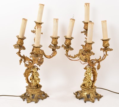 Lot 731 - Pair of ormolu four branch candelabra converted for electricity