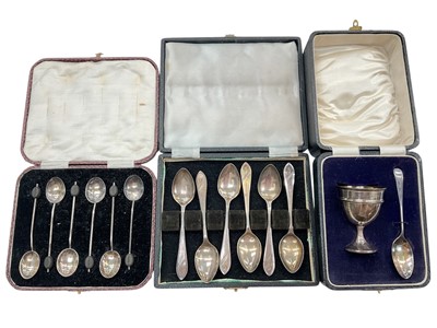 Lot 1178 - Set of six silver bean end coffee spoons, set of six silver teaspoons and a silver egg cup and spoon, all in fitted cases