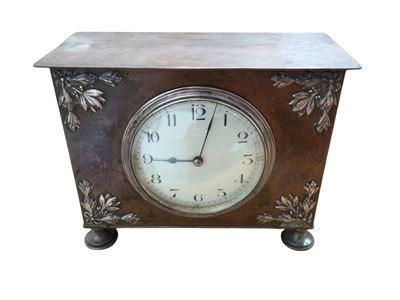 Lot 297 - Arts and crafts hammered copper cased clock with French movement and cream dial