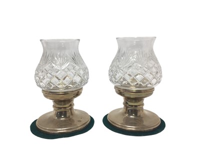 Lot 197 - Pair contemporary silver candlesticks fitted with cut glass storm shades.