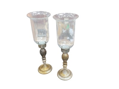 Lot 562 - Pair of contemporary silver plated and glass storm lanterns, each 53cm in overall height, (2).