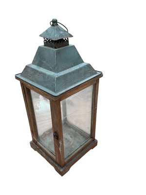 Lot 565 - Large wood and glass garden lantern, 63cm in overall height.