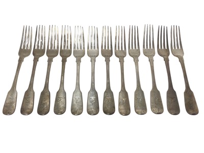 Lot 173 - Set of twelve George IV silver Fiddle pattern table forks, with engraved armorial crest