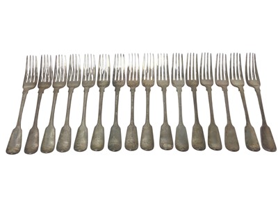 Lot 174 - Set of sixteen George IV silver Fiddle pattern table forks with engraved armorial crests