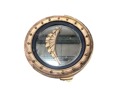 Lot 1444 - Nineteenth century circular gilt framed mirror with ebonised slip, 64cm diameter