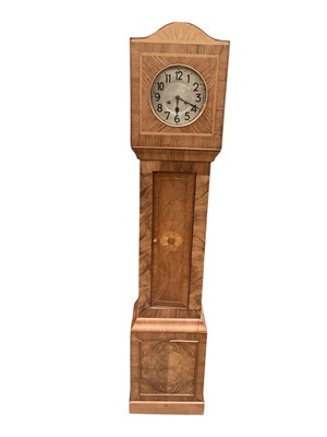 Lot 1447 - Early 20th century walnut Granddaughter clock, together with a children's stick back elbow chair (2)