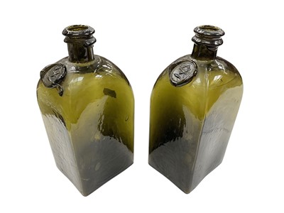 Lot 383 - Pair of green glass seal bottles, 18.5cm high