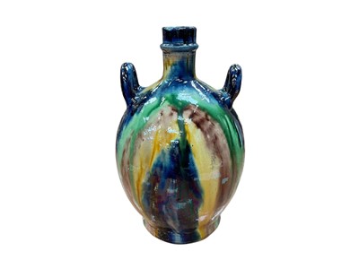 Lot 583 - Late 19th century continental majolica wine vessel with drip glazed decoration, 26cm in overall height.