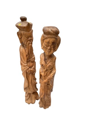 Lot 593 - Pair of far eastern carved wood figures, the largest 101cm in overall height, (2).