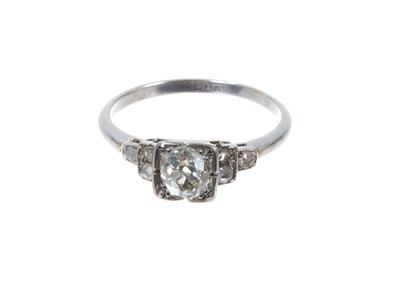 Lot 388 - Art Deco diamond and platinum ring with an old cut diamond in square claw setting with rose-cut diamonds to the stepped shoulders on platinum shank