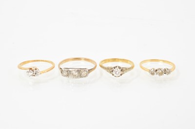 Lot 394 - Four early 20th century diamond rings in platinum settings on 18ct gold shanks