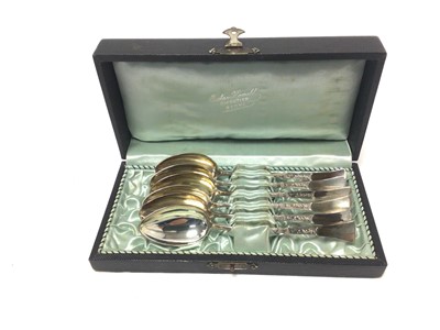 Lot 206 - Set of six continental silver spoons with raised decoration and flared terminals, in a fitted case