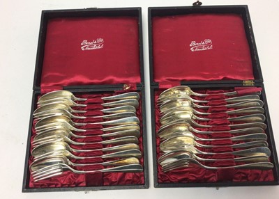 Lot 207 - Two cased sets of six pairs of Swiss silver dessert spoons and forks, marked Borel & Cie.