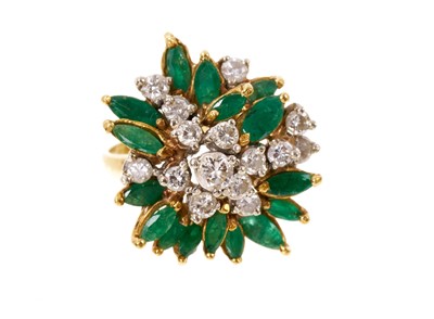 Lot 413 - Emerald and diamond cocktail ring with an asymmetric cluster of brilliant cut diamonds and marquise-cut emeralds in 18ct gold claw setting