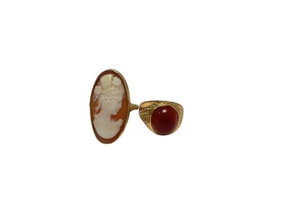 Lot 123 - Carved shell cameo ring in yellow metal setting and a carnelian cabochon yellow metal signet ring (2)