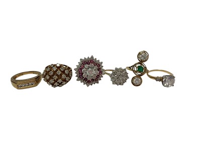 Lot 125 - 9ct gold diamond five stone ring in channel setting, three 9ct gold gem set cluster cocktail rings, synthetic single stone ring stamped 14K and a yellow metal vertical three stone ring (6)