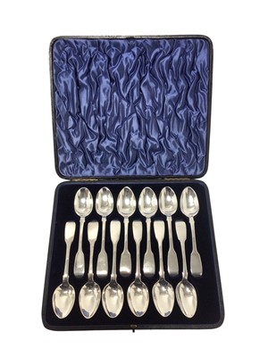 Lot 216 - Set of twelve Victorian silver fiddle pattern teaspoons in fitted case, all at approximately 9.0 oz