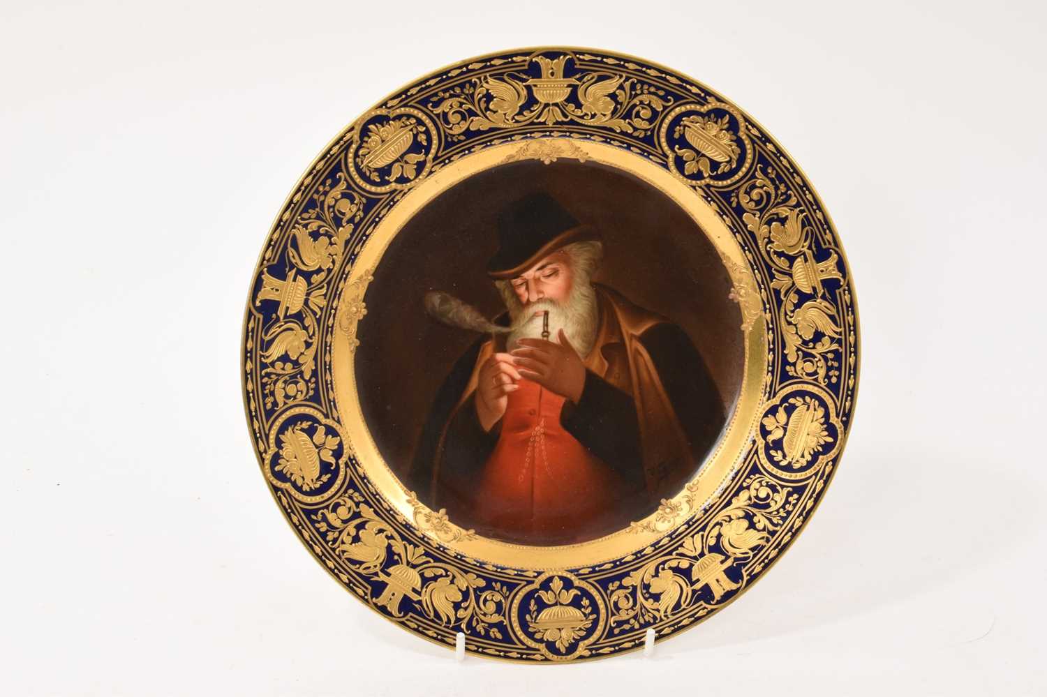 Lot 3 - Vienna plate, finely painted with a man smoking, signed Wagner
