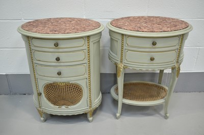 Lot 1412 - Two similar 19th century style French carved green painted and gilded bedside cabinets with oval rouge marble tops
