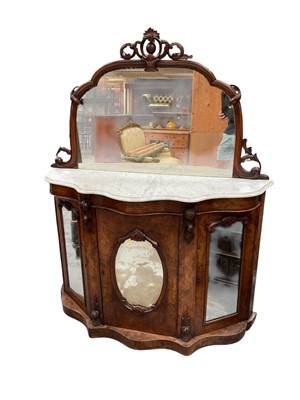 Lot 1406 - Victorian burr walnut veneered credenza with arched mirrored back, serpentine fronted marble top and cupboards below enclosed by three mirrored panelled doors