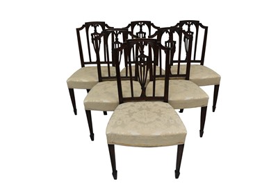 Lot 1392 - Set of eight George III style Hepplewhite revival carved mahogany dining chairs