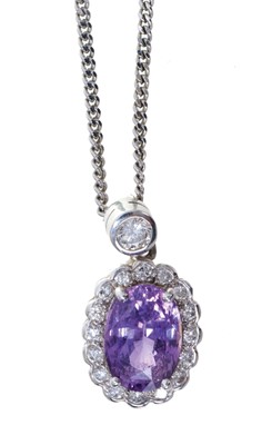 Lot 359 - Purple sapphire and diamond cluster pendant on 9ct white gold chain