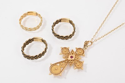 Lot 618 - Gold filigree cross pendant on a chain, together with three yellow metal and elephant hair / woven material rings (4)