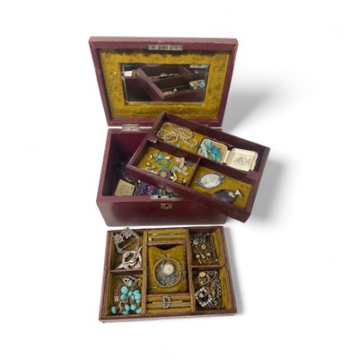 Lot 620 - Victorian red leather jewellery box containing a collection of antique and vintage costume jewellery to include a 1920s silver and turquoise blue enamel pendant watch on matching chain.
