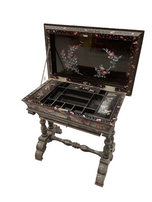 Lot 1427 - 19th century Chinese papier mâché and mother of pearl inlaid work table, the hinged rectangular cushion top inlaid with fighting cocks and enclosing a fitted interior with cushion drawer below o...