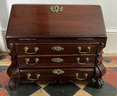 Lot 1426 - 18th century Dutch miniature mahogany bureau, with fitted interior and three graduated drawers to the bombe front on hairy paw feet, 54cm wide x 33cm deep x 43cm high