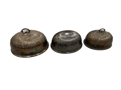 Lot 1435 - Three similar Victorian silver plated meat covers, each engraved with initials, the largest approximately 45cm wide