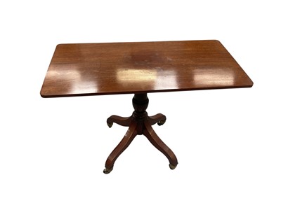 Lot 1437 - George III mahogany tilt occasional table, the rounded rectangular top on baluster column and four cabriole legs on brass castors, 96cm wide x 49cm deep x 71cm high